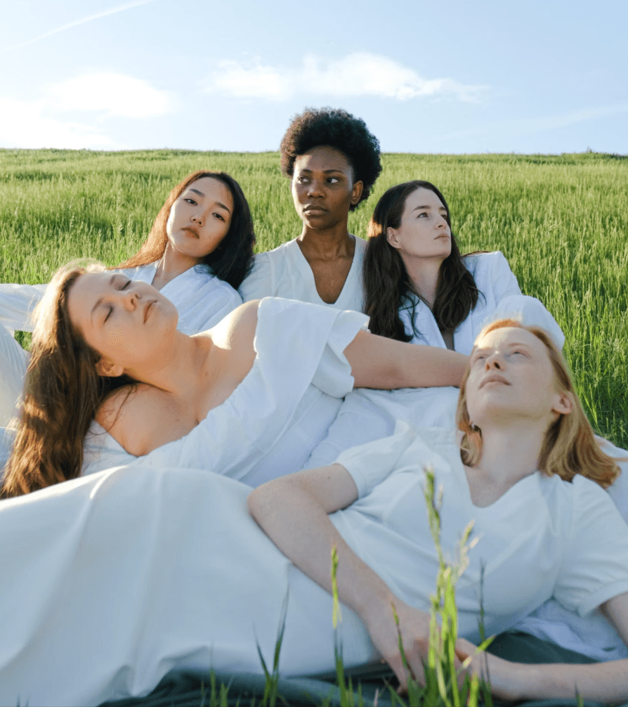 A diverse community resting together outdoors